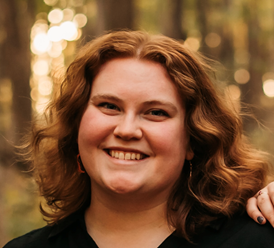 A photo of a smiling woman.