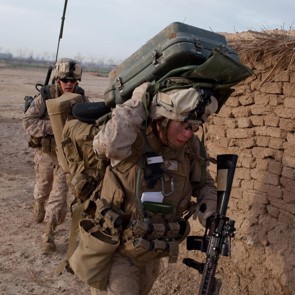 three men in military uniforms in line of duty